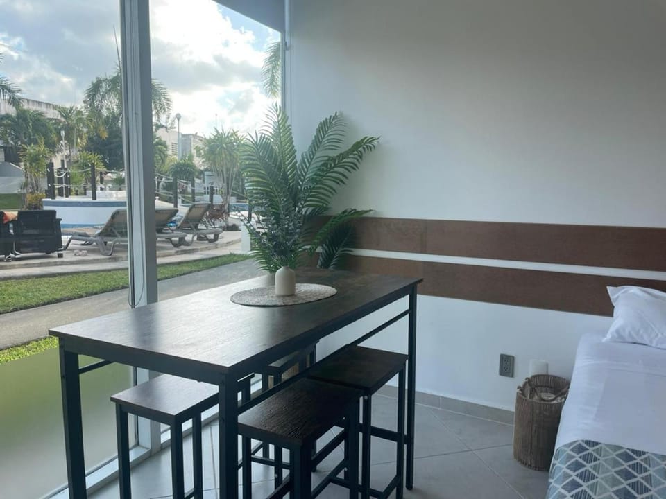 Bed, Dining area, Pool view, sunbed
