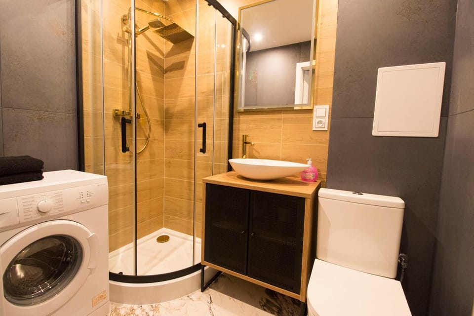 Shower, Toilet, Bathroom, towels, washing machine, dryer