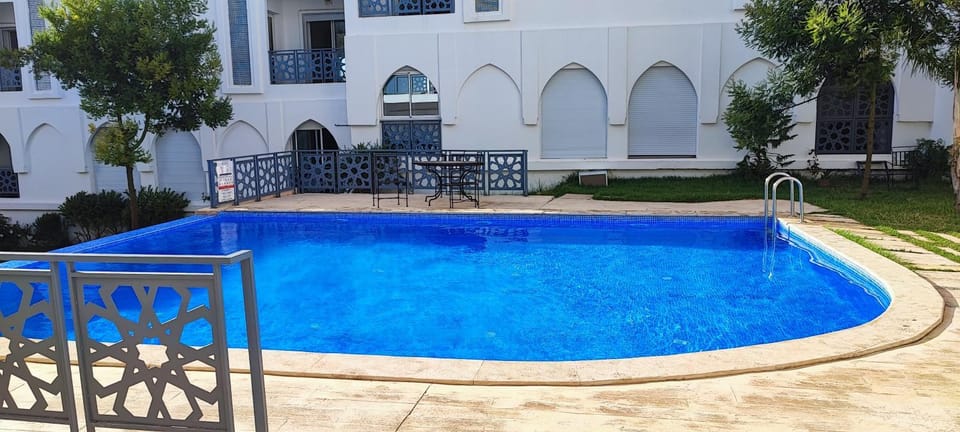 Property building, Patio, Day, Pool view, Swimming pool