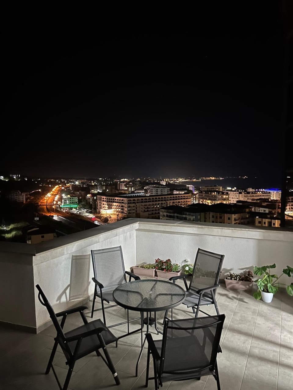 Property building, Patio, Night, View (from property/room), Balcony/Terrace, Seating area, Dining area, City view