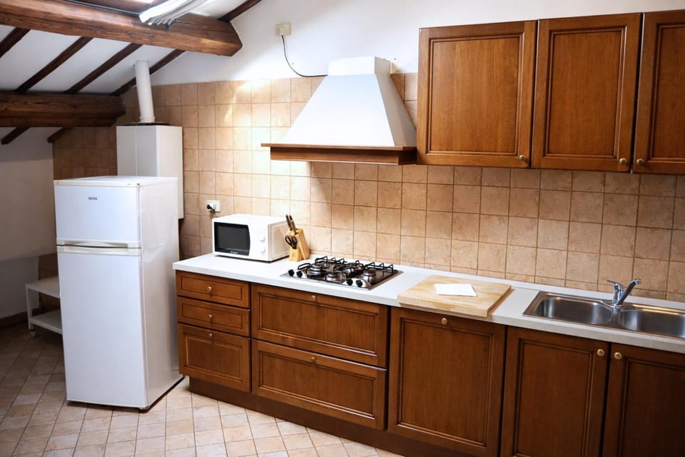 Kitchen or kitchenette, dishwasher, oven, stove