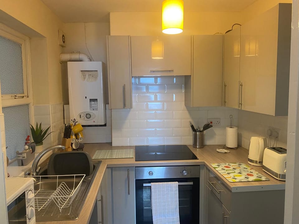 Kitchen or kitchenette, stove, toaster