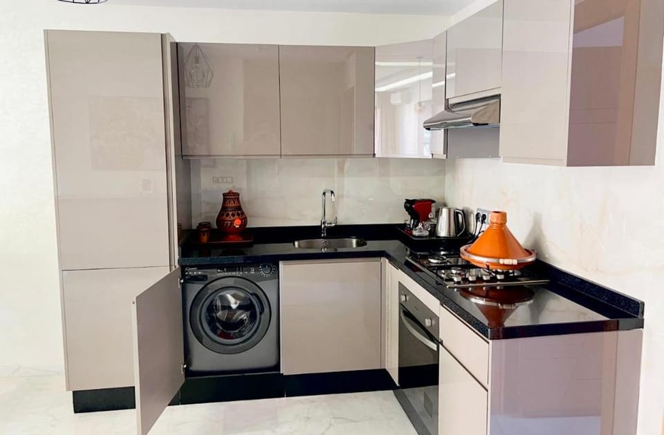 Kitchen or kitchenette, stove, washing machine