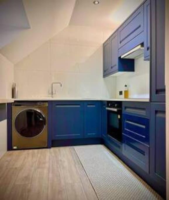 Kitchen or kitchenette, washing machine