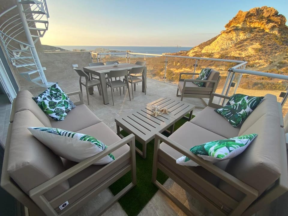 Nearby landmark, Natural landscape, View (from property/room), Balcony/Terrace, Living room, Seating area, Dining area, Mountain view, Sea view