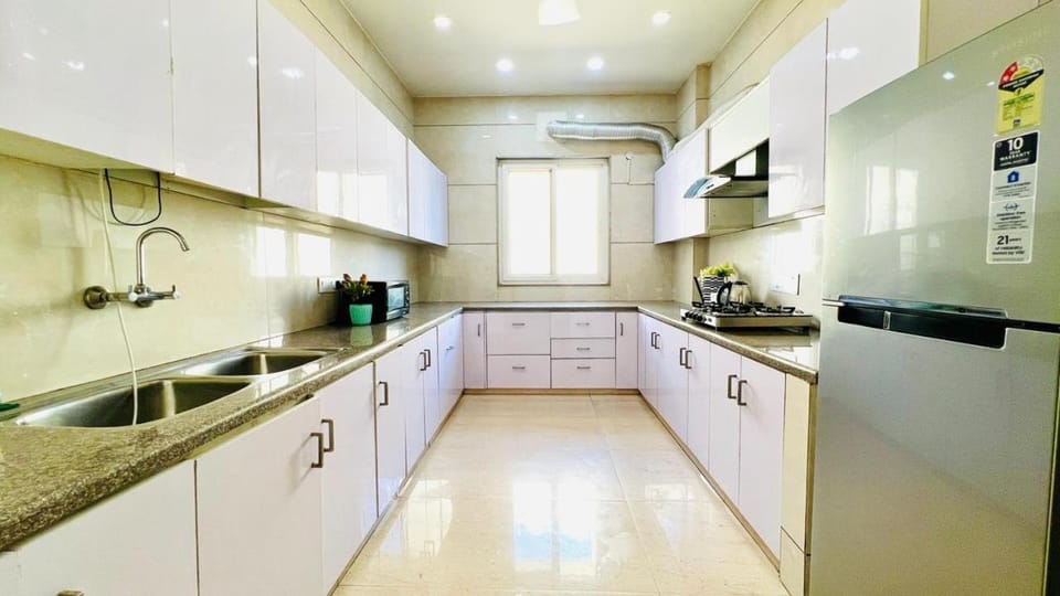 Kitchen or kitchenette, dishwasher, oven, stove