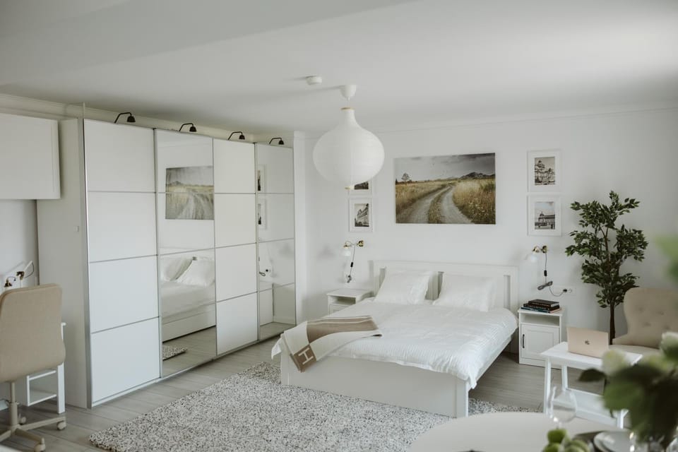 Bed, towels, wardrobe