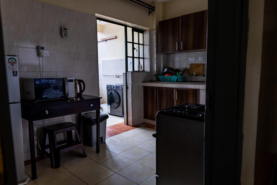 Kitchen or kitchenette, dishwasher, oven, stove