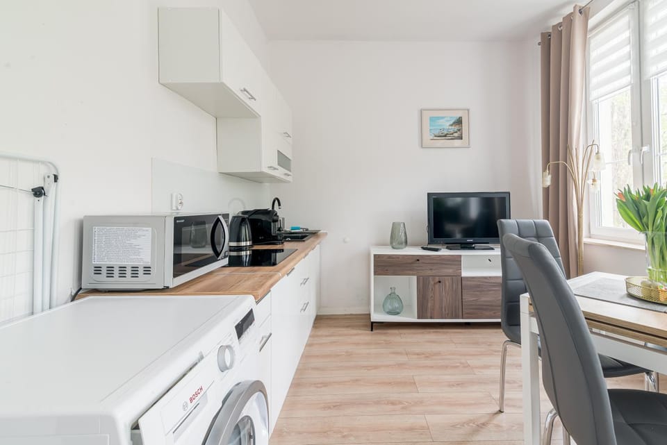 TV and multimedia, Kitchen or kitchenette, Decorative detail, Dining area, minibar, stove, washing machine, dryer