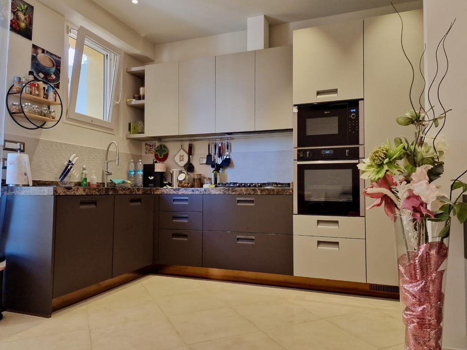 Kitchen or kitchenette, dishwasher, oven, stove