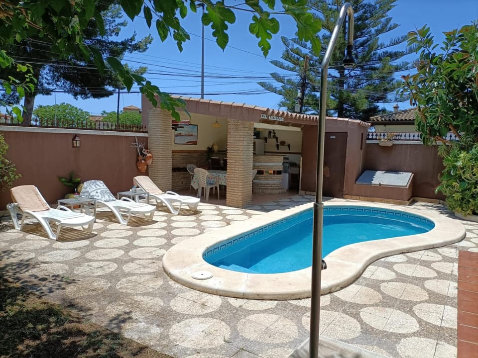 Patio, Day, Pool view, sunbed