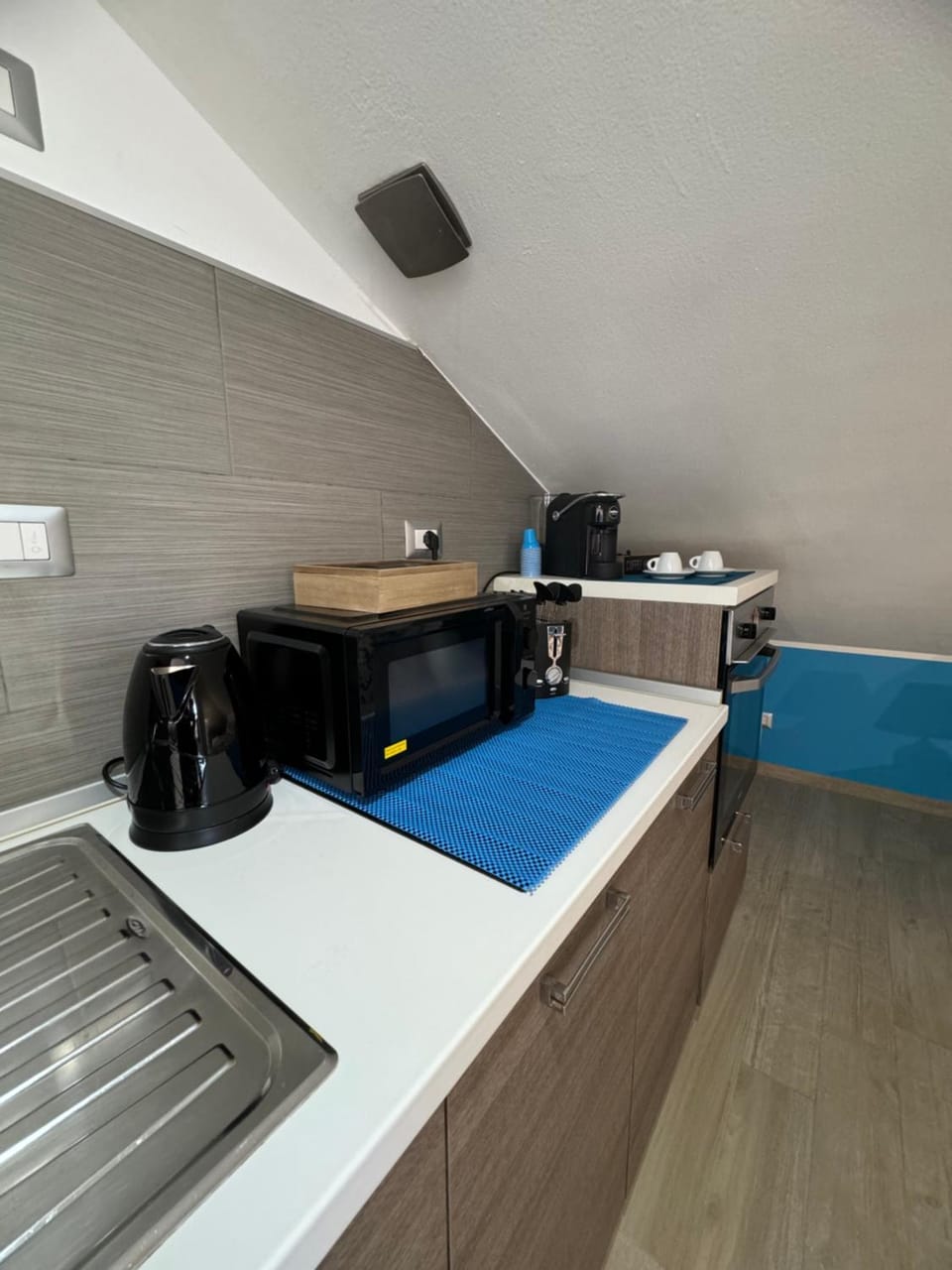 Kitchen or kitchenette, microwave, stove, toaster