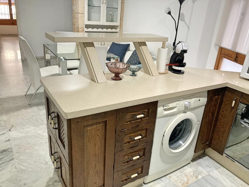 Kitchen or kitchenette, washing machine