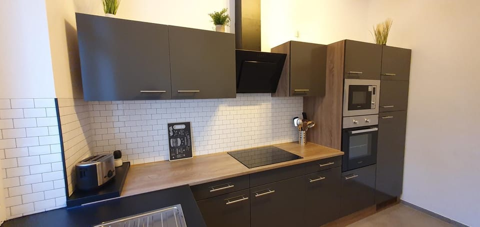 Kitchen or kitchenette, dishwasher, oven, stove, toaster