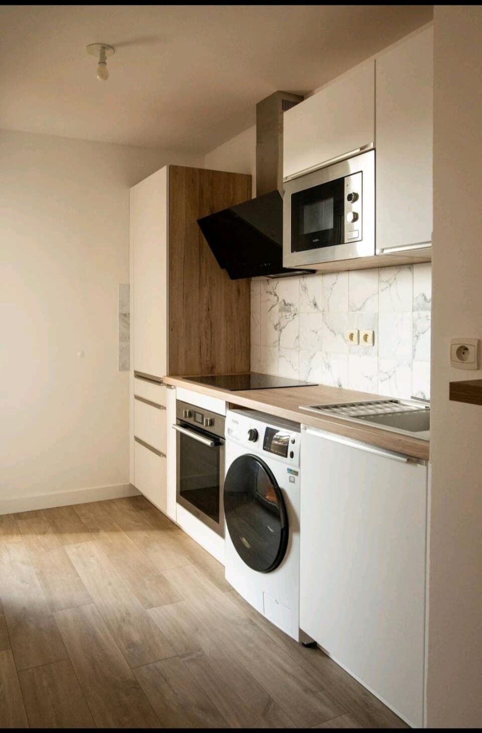Kitchen or kitchenette, oven, stove, washing machine, dryer