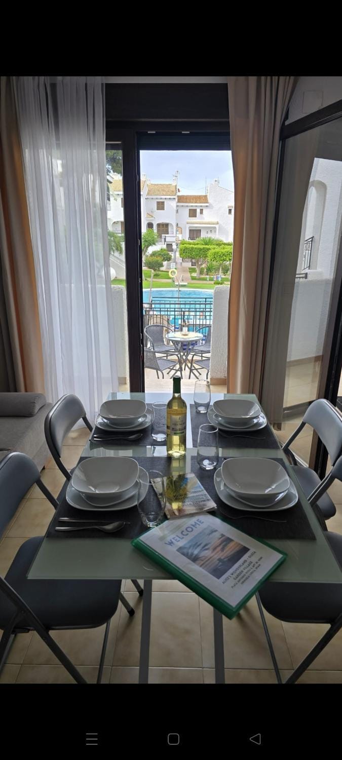 View (from property/room), Balcony/Terrace, Living room, Seating area, Dining area, Pool view