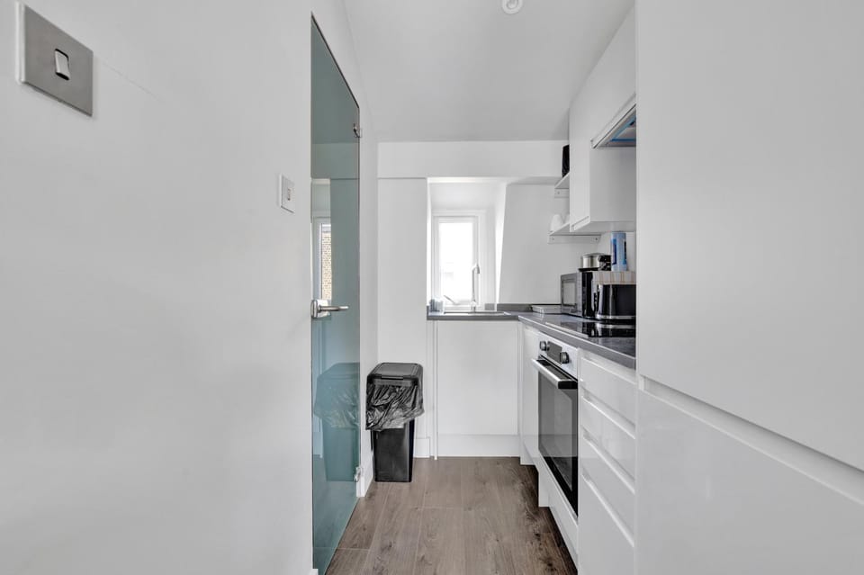 Kitchen or kitchenette, dishwasher, oven, stove, toaster
