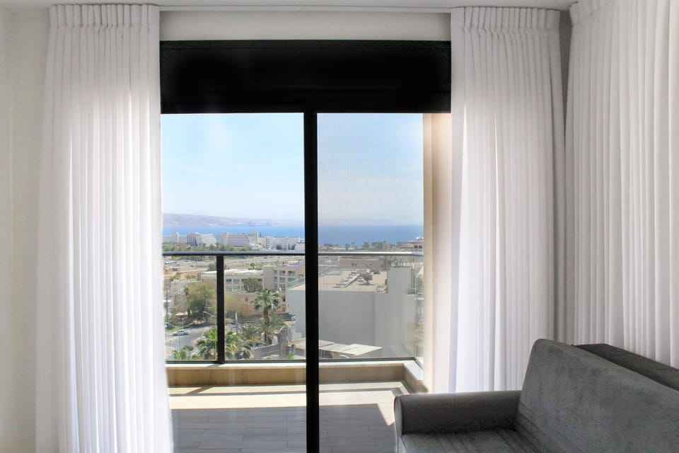 View (from property/room), Balcony/Terrace, Living room, Seating area, City view, Mountain view, Sea view