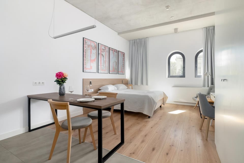 Bed, Living room, Seating area, Dining area