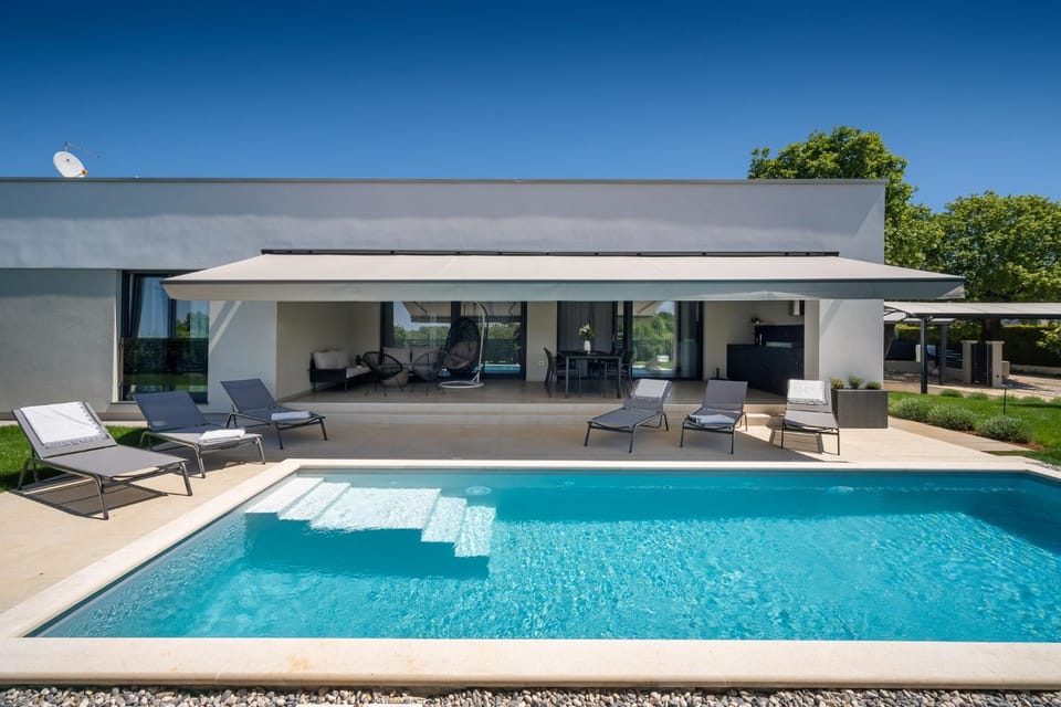 Property building, Patio, Day, Balcony/Terrace, Seating area, Pool view, Swimming pool, sunbed, towels