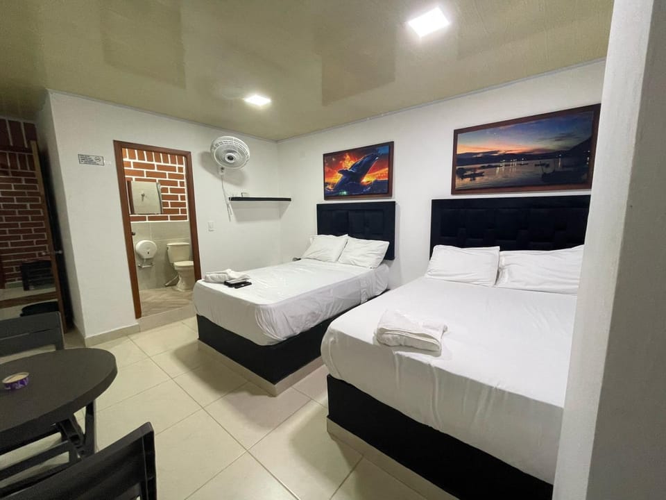 Photo of the whole room, towels, air conditioner