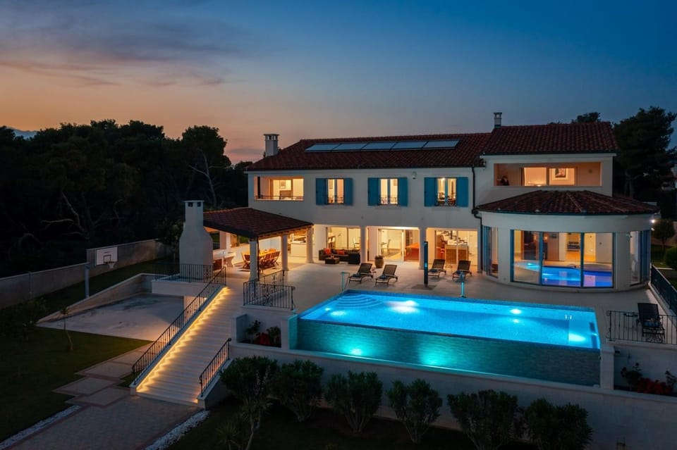 Property building, Patio, Night, Pool view, Swimming pool