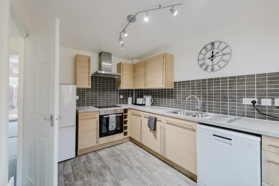 Kitchen or kitchenette, dishwasher, oven, stove, toaster