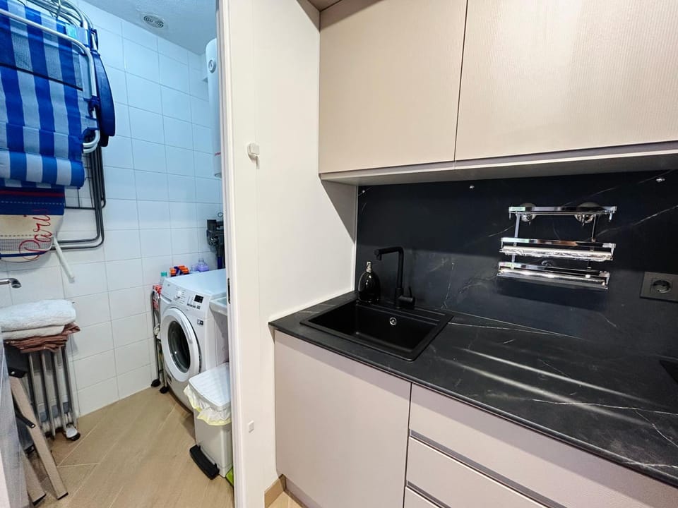 Kitchen or kitchenette, washing machine