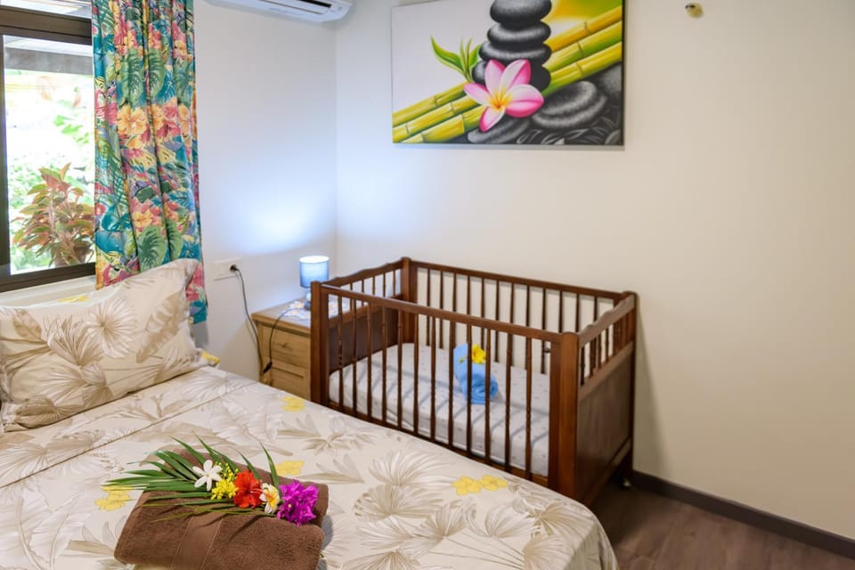 Bedroom, cot, towels, air conditioner