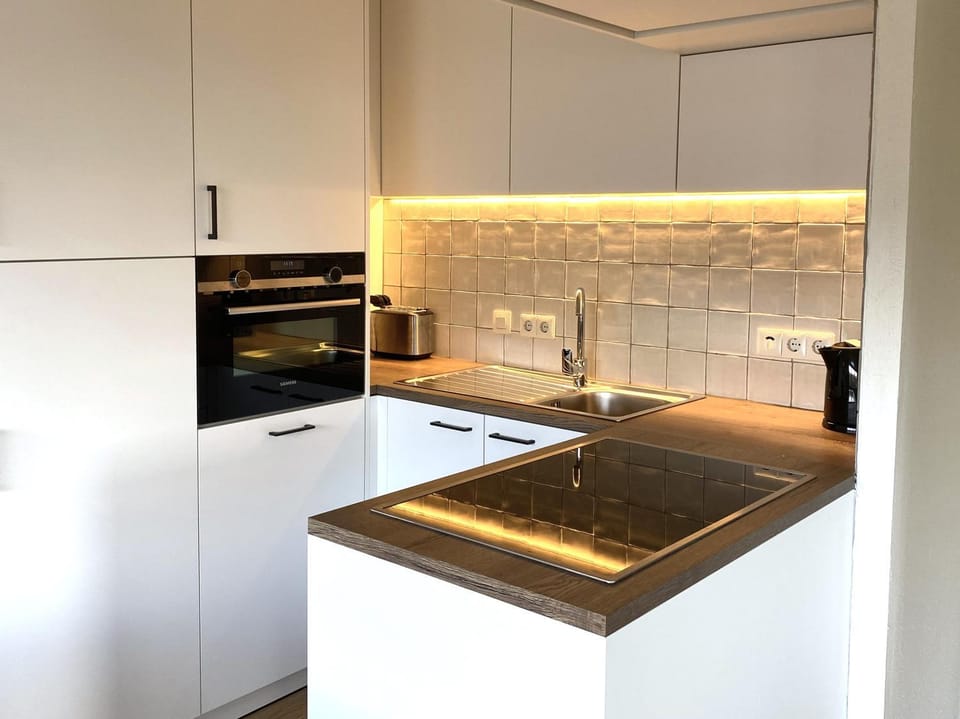 Kitchen or kitchenette, oven, stove