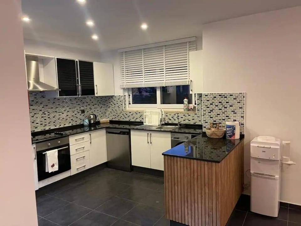 Kitchen or kitchenette, dishwasher, oven, stove, washing machine