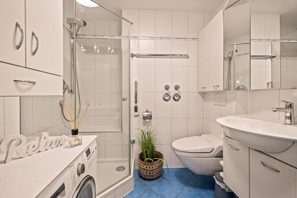 Shower, Toilet, Bathroom, towels, washing machine, dryer