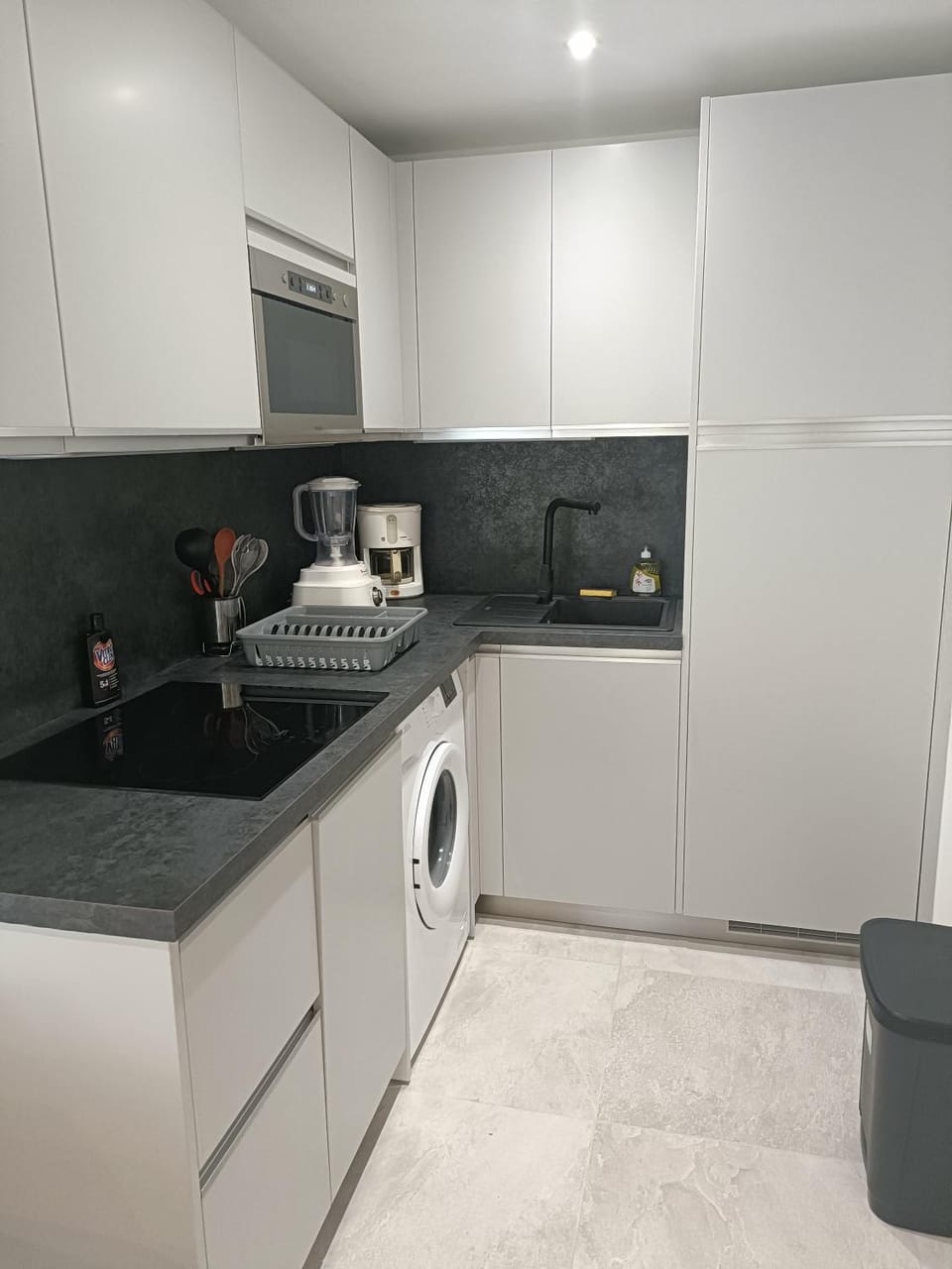 Kitchen or kitchenette, dishwasher, oven, stove, washing machine