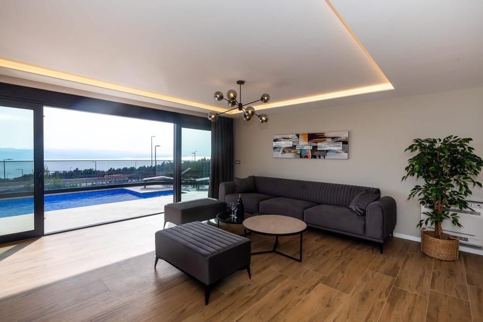 Living room, Seating area, Pool view