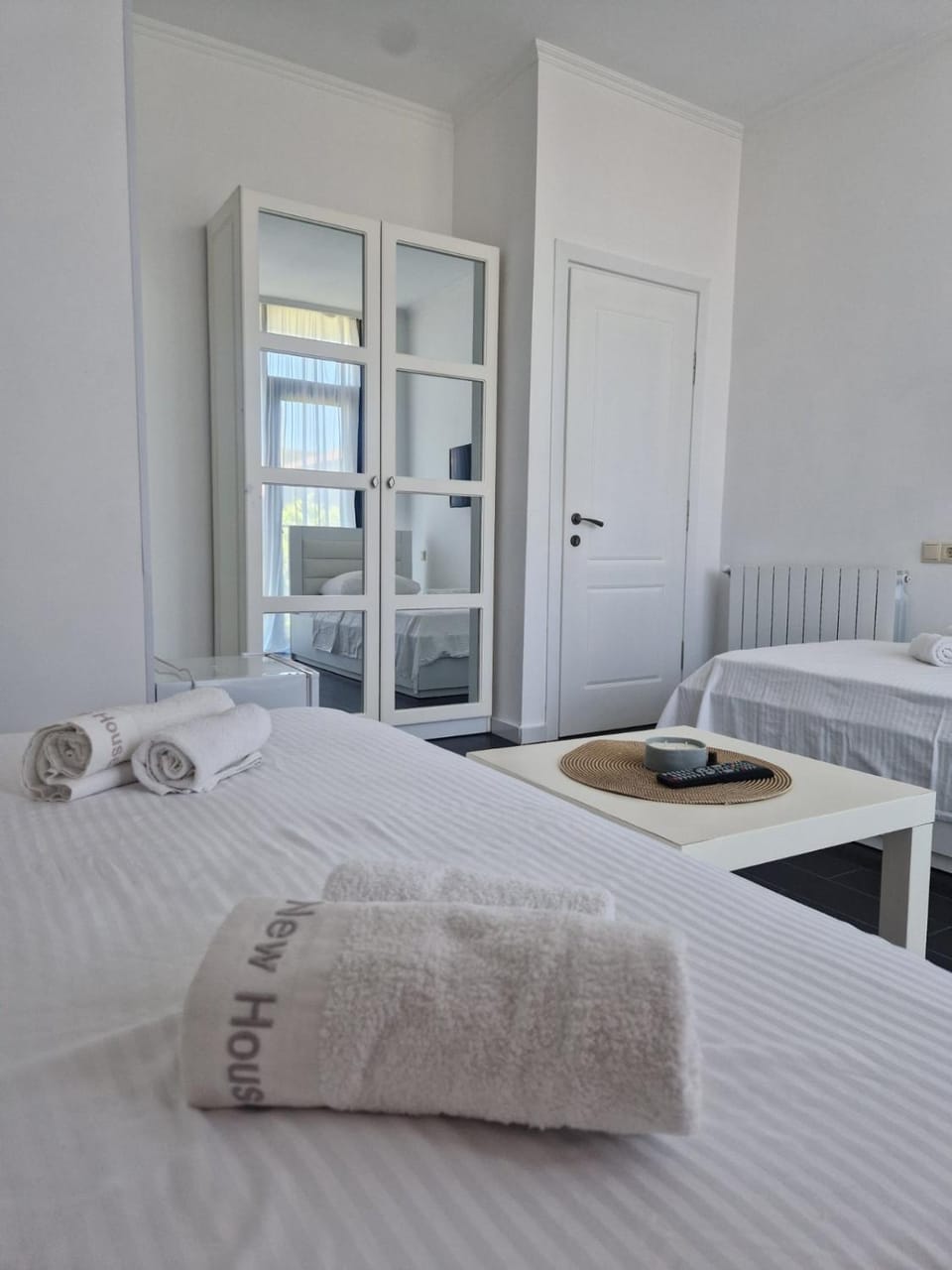 Bed, towels, wardrobe