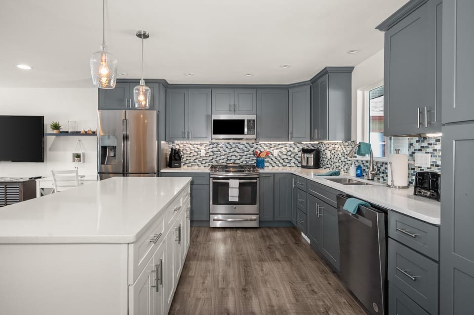 Kitchen or kitchenette, dishwasher, oven, stove