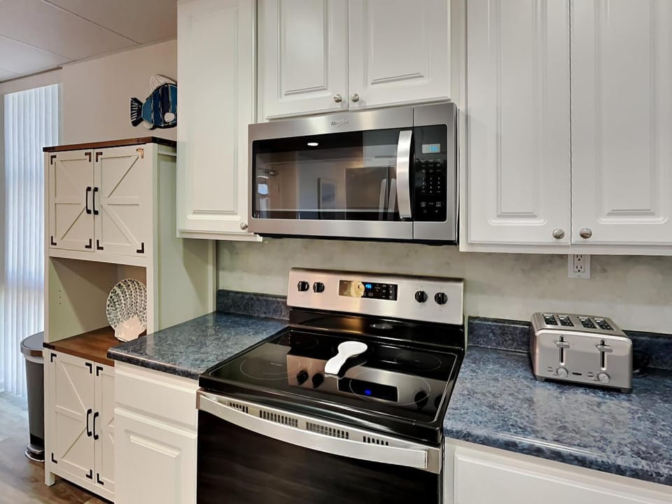 Kitchen or kitchenette, microwave, oven, stove, toaster