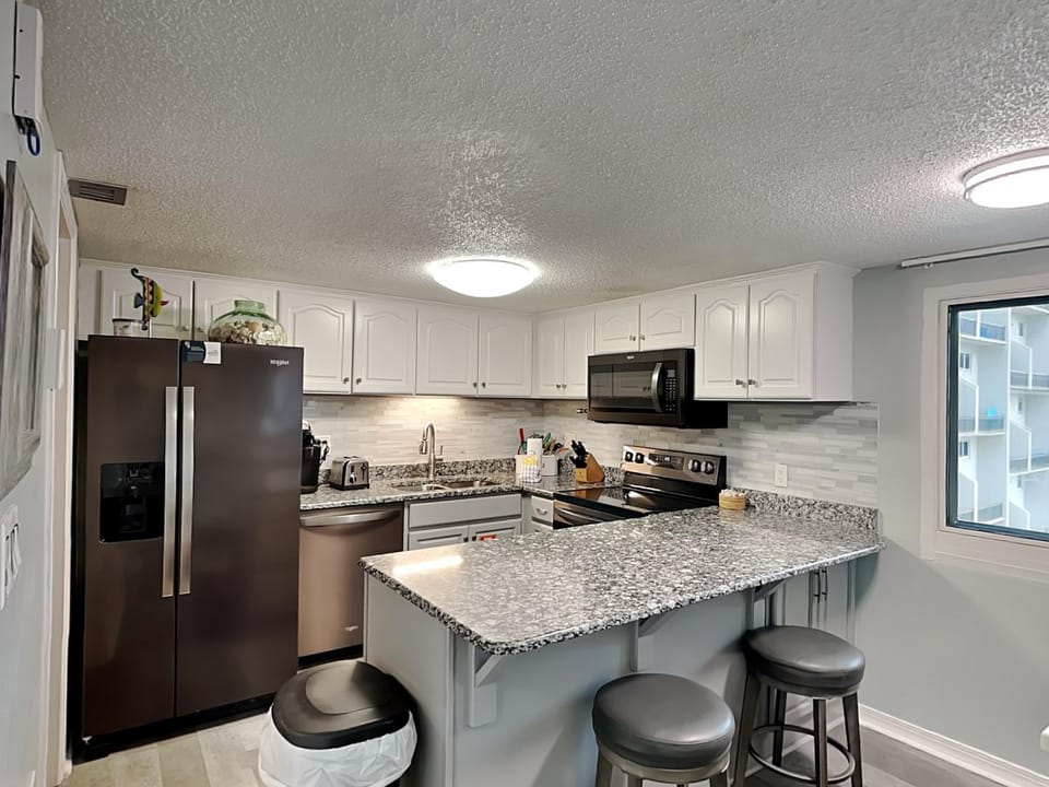 Kitchen or kitchenette, microwave, oven, stove, kitchen