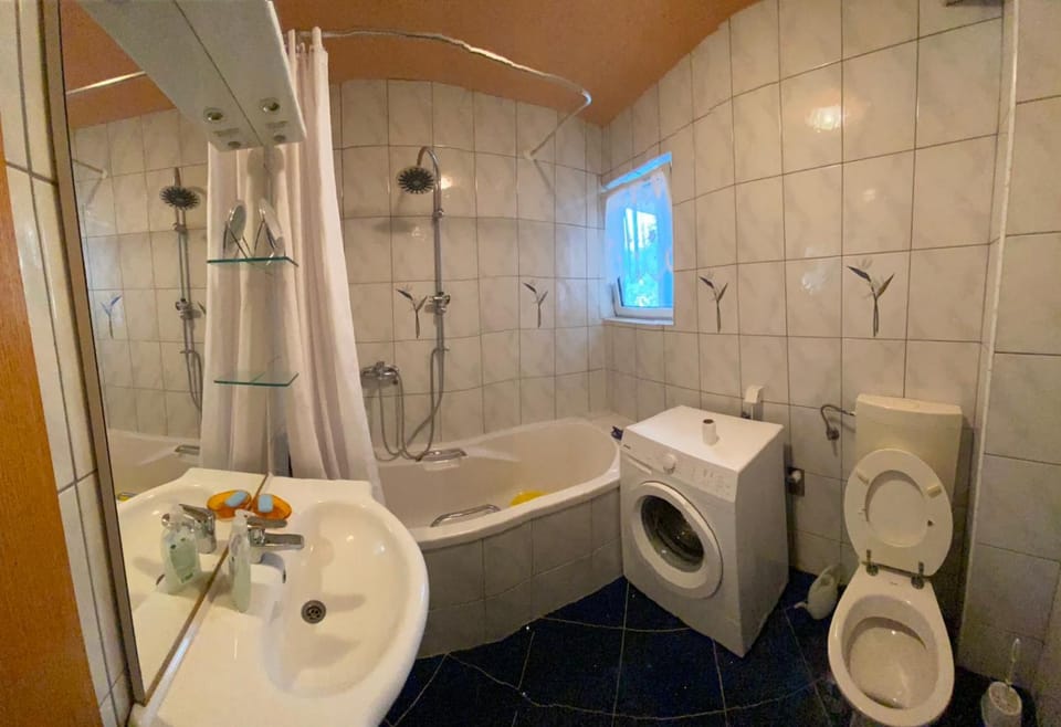 Toilet, Bathroom, Bath, bidet, towels, washing machine, dryer