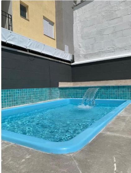Apartamento novo região central de Ubatuba, com churrasqueira e varanda, 2 vagas - Residencial Jathy Apartment in Ubatuba