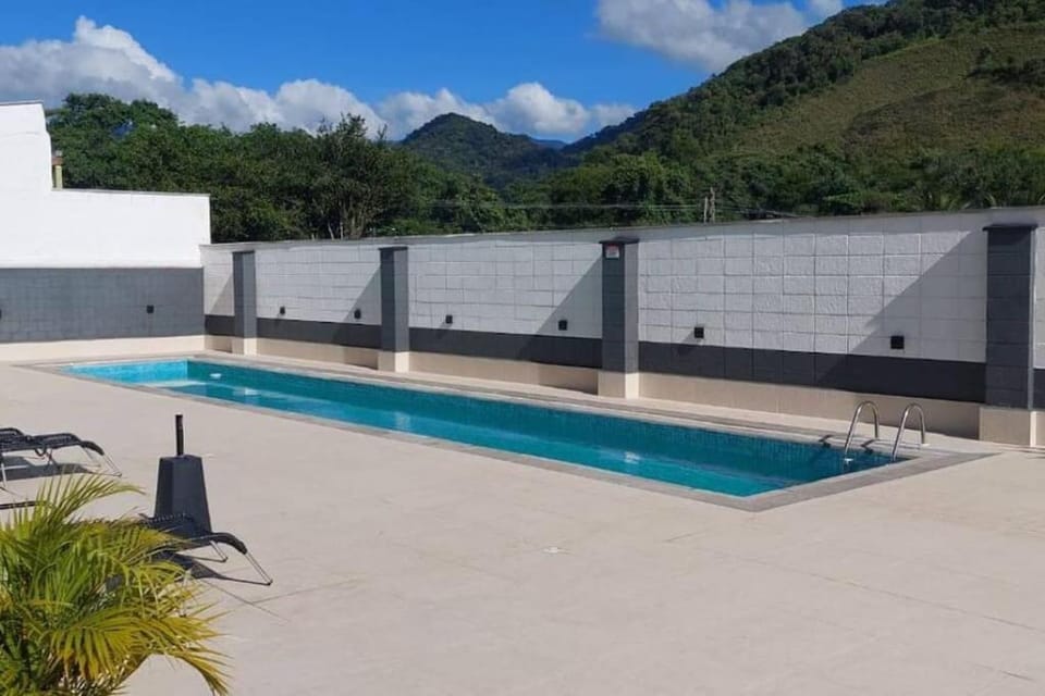 Apartamento novo região central de Ubatuba, com churrasqueira e varanda, 2 vagas - Residencial Jathy Apartment in Ubatuba