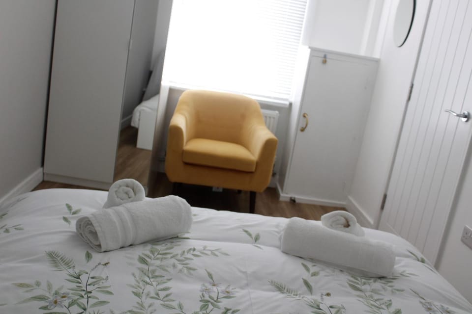 Bed, Seating area, Bedroom, towels, wardrobe
