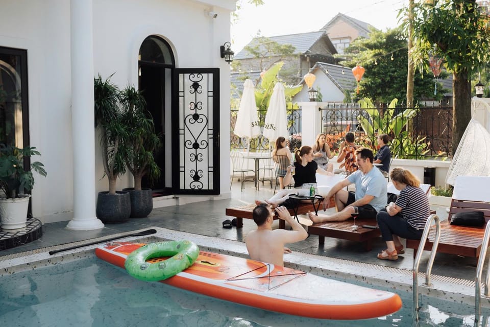 Patio, Communal lounge/ TV room, Day, People, Natural landscape, Living room, Seating area, Evening entertainment, Guests, Pool view, Swimming pool, group of guests, sunbed