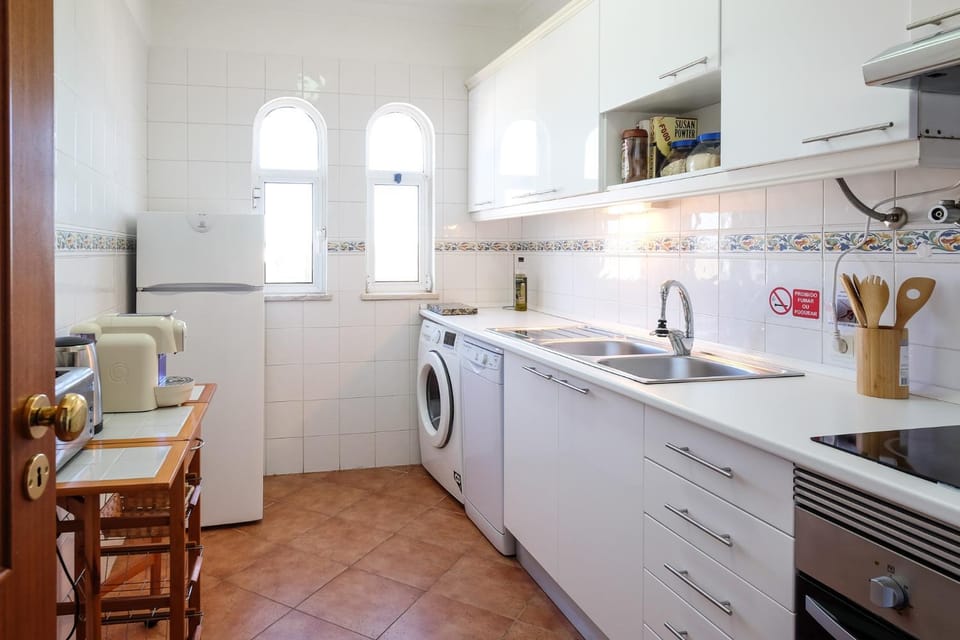 Kitchen or kitchenette, dishwasher, oven, stove, washing machine