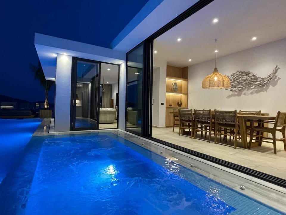Property building, Night, Dining area, Pool view, Swimming pool