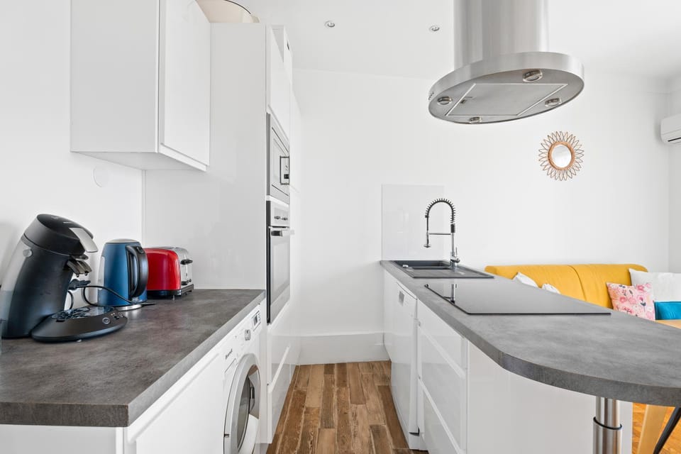 Kitchen or kitchenette, dishwasher, oven, stove, toaster
