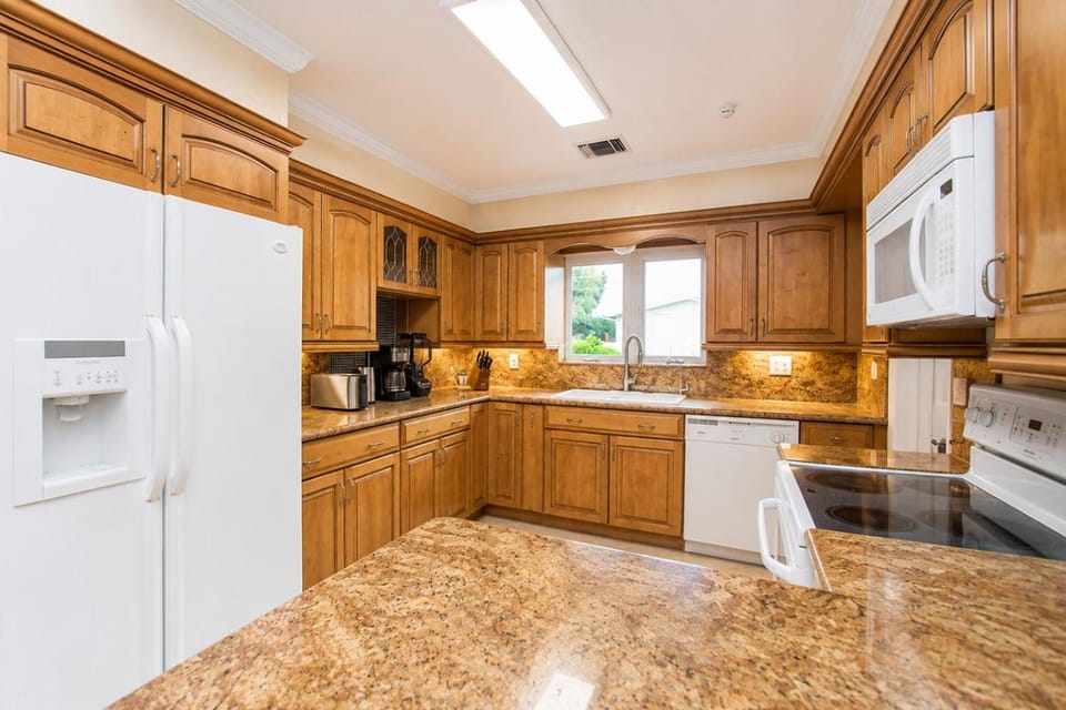 Kitchen or kitchenette, dishwasher, oven, stove, toaster