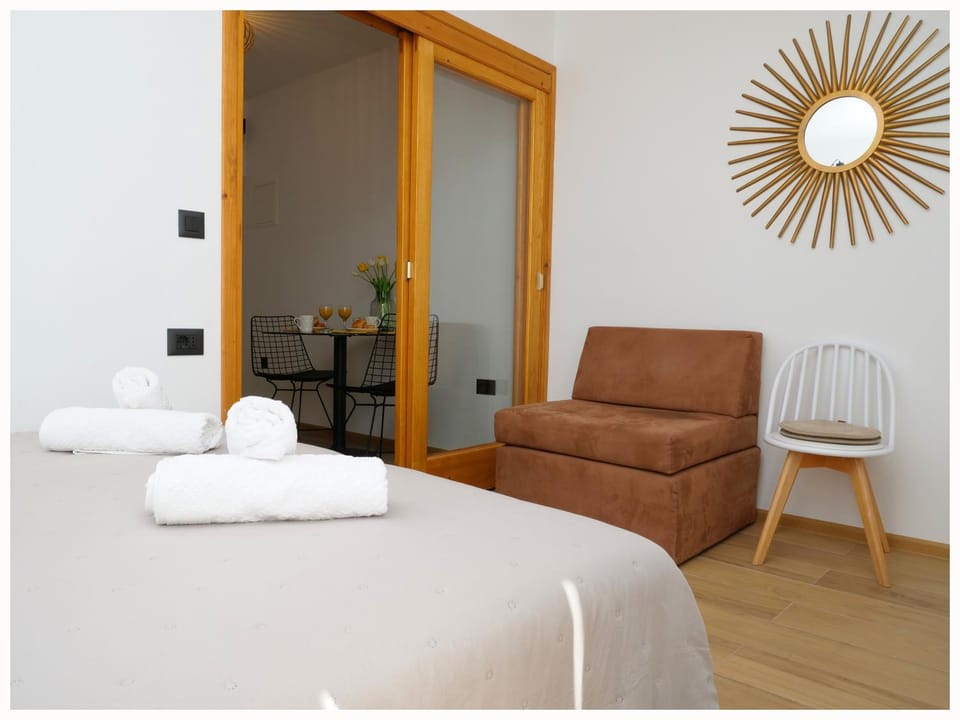 Bed, Living room, Seating area, Bedroom