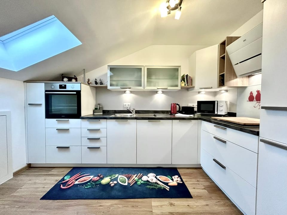 Kitchen or kitchenette, dishwasher, oven, stove, toaster