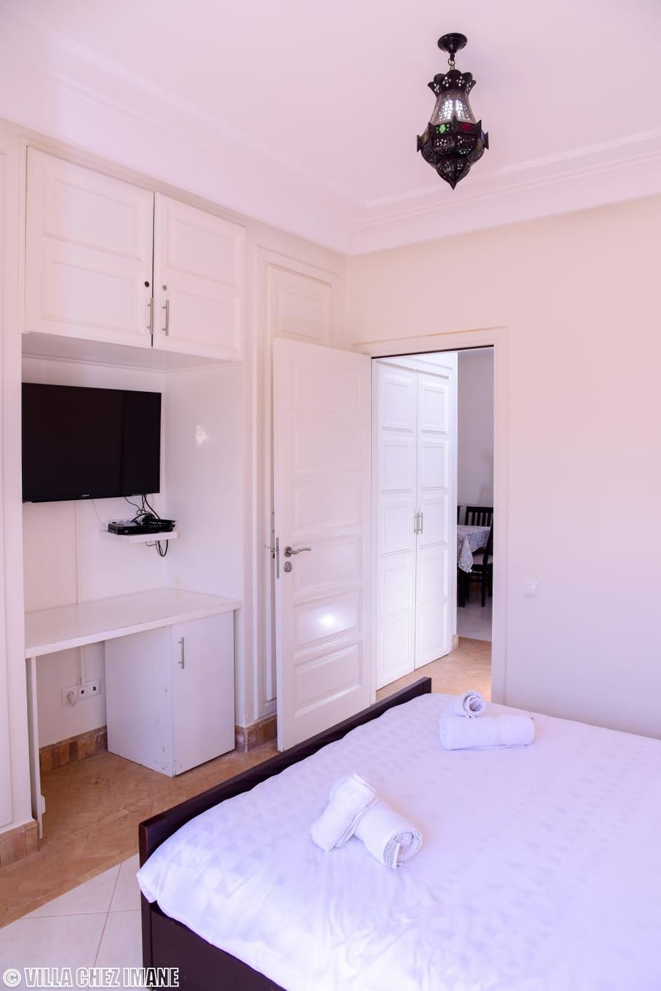 Bed, Seating area, towels, wardrobe